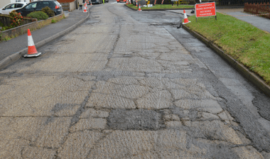 What are the types of cracking in roads?